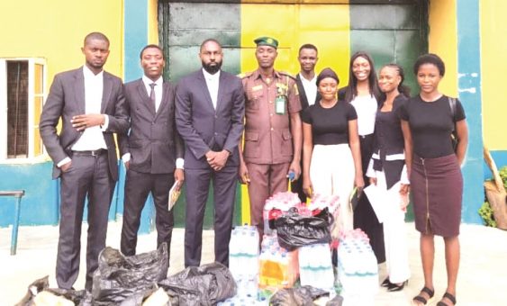 Law firm donates food, others to inmates 1 Popoola Taiwo third left 563x340 1